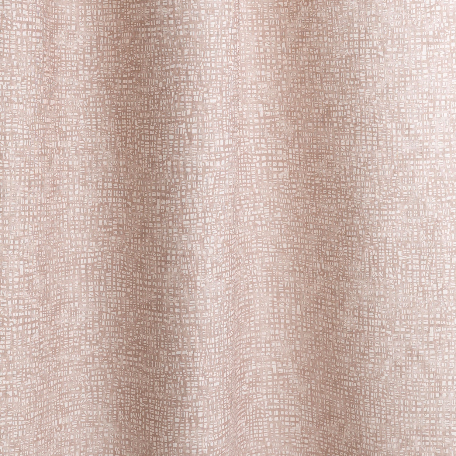 Gently draped fabric in a textural wicker pattern in blush pink on a white field. 
