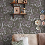 Living room with floral wallpaper, a sofa, and decorative items.