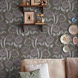 Living room with floral wallpaper, a sofa, and decorative items.