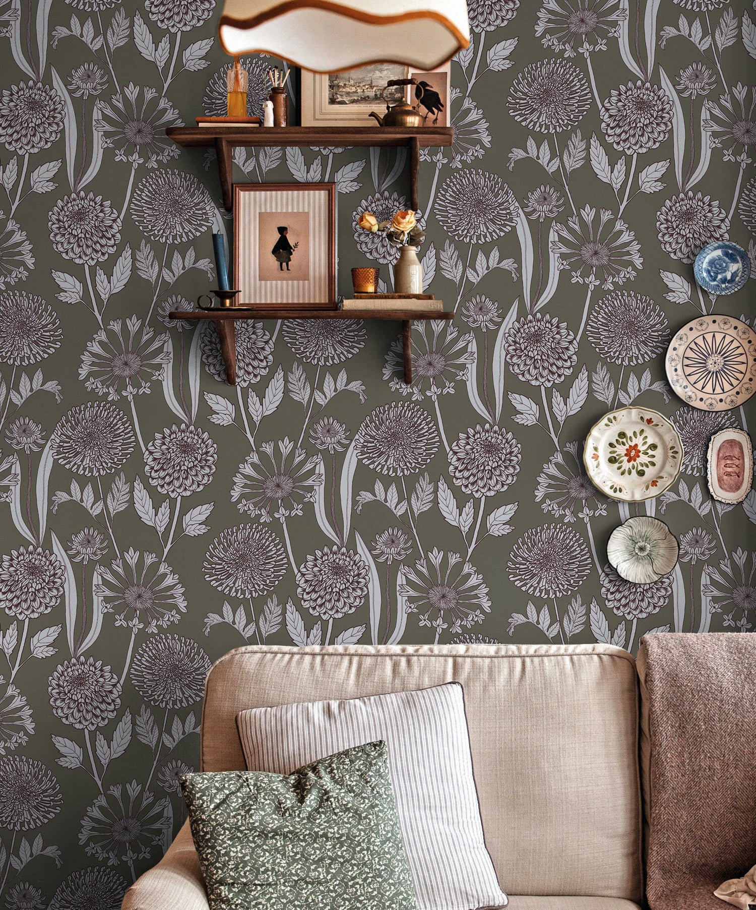 Living room with floral wallpaper, a sofa, and decorative items.