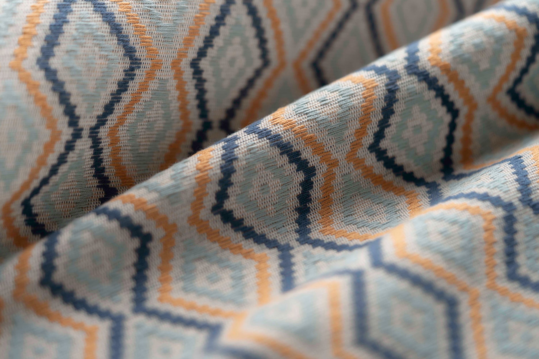 Close-up of fabric with blue and yellow geometric pattern
