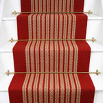 Striped flatweave runner in red and cream on white staircase