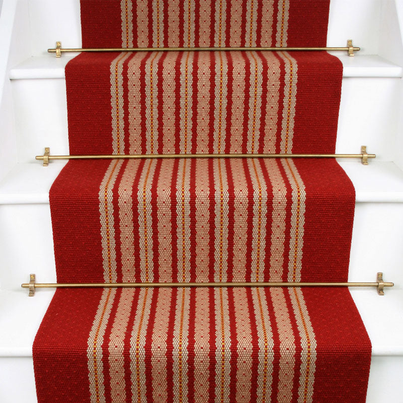 Striped flatweave runner in red and cream on white staircase