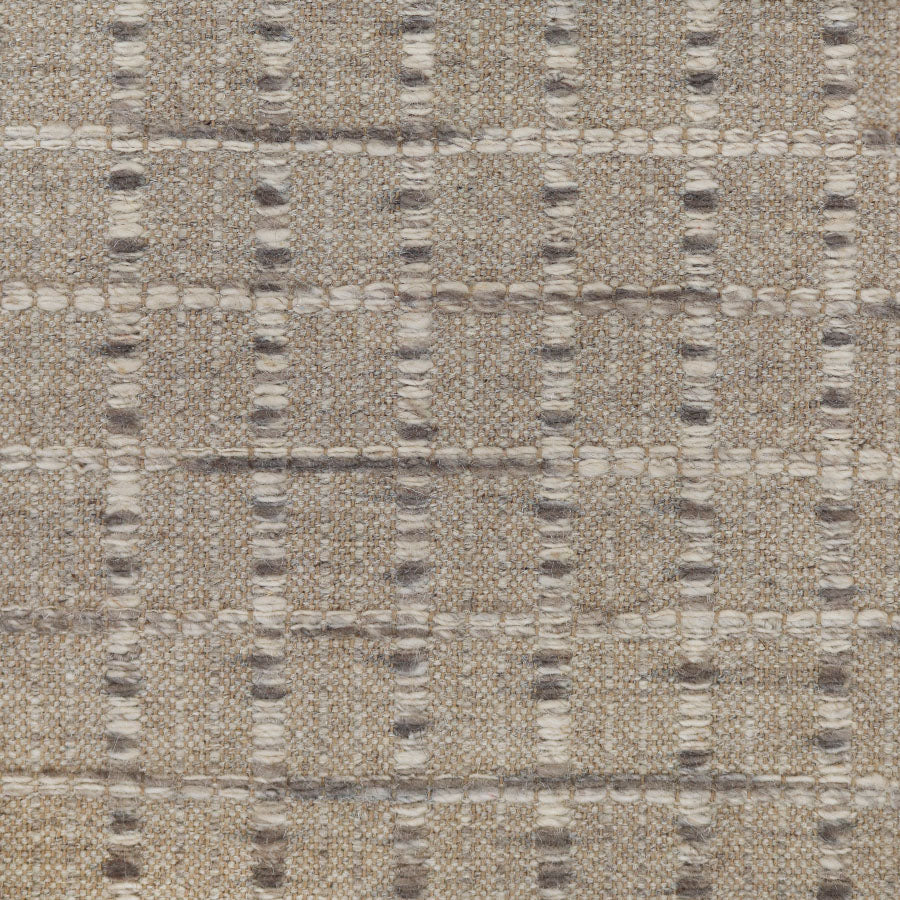 Broadloom carpet with raised gridded plaid in shades of grey and cream on an oatmeal ground. 