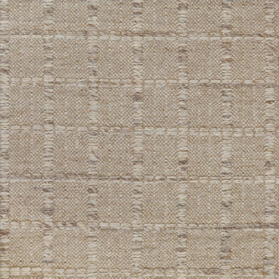 Broadloom carpet with raised gridded plaid in shades of cream and taupe on an oatmeal ground. 