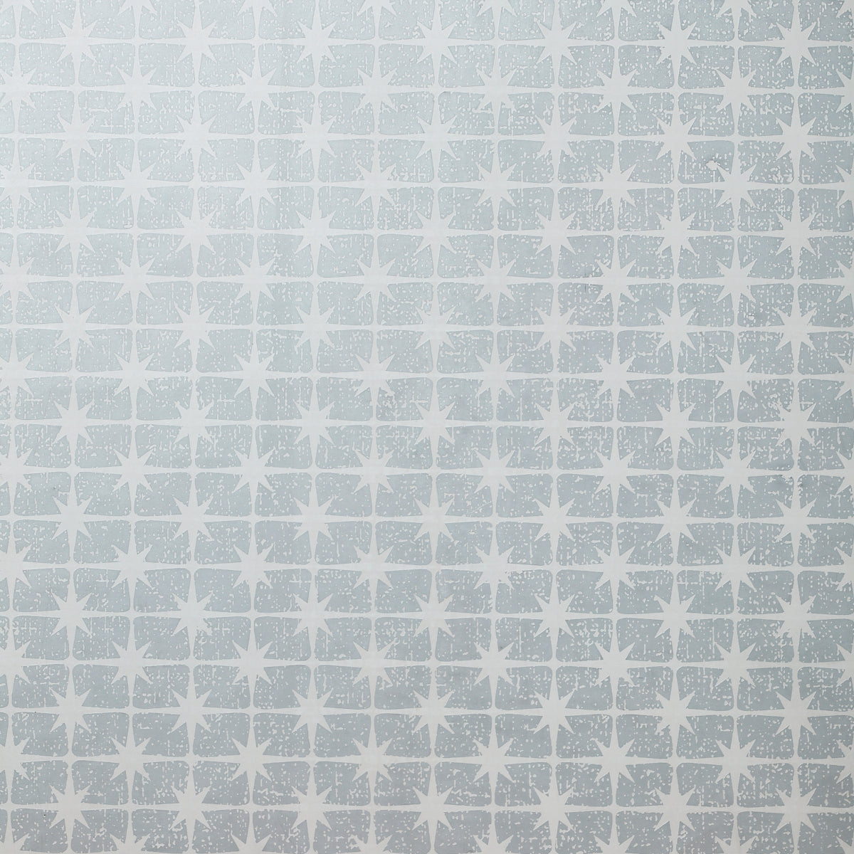 Detail of wallpaper in a geometric damask print in cream on a light blue field.