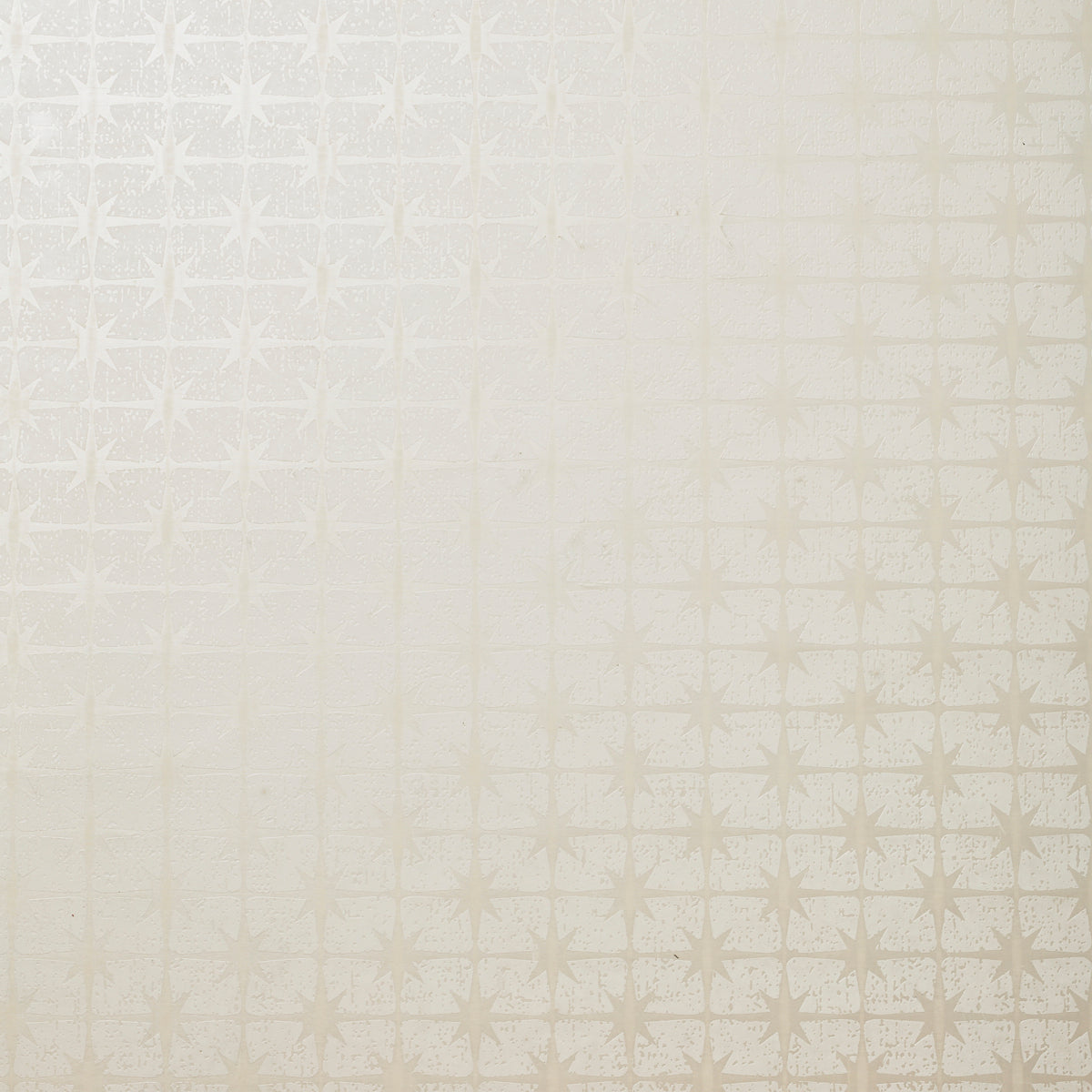 Detail of wallpaper in a geometric damask print in cream.