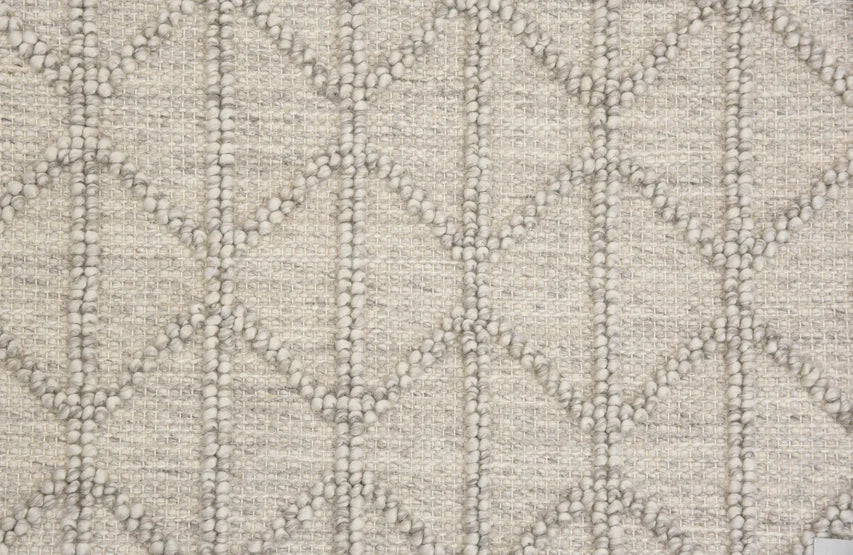 Broadloom carpet swatch in a diamond textured pattern in a grey design
