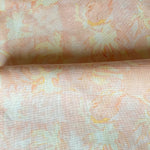 Drape fabric in painterly tropical checkerboard design in pinky orange and yellow. 