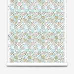 Wallpaper roll with painterly tropical checkerboard design in aqua blue, pink and tan.