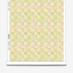 Wallpaper roll in painterly tropical checkerboard design in lime green, yellow and orange. 