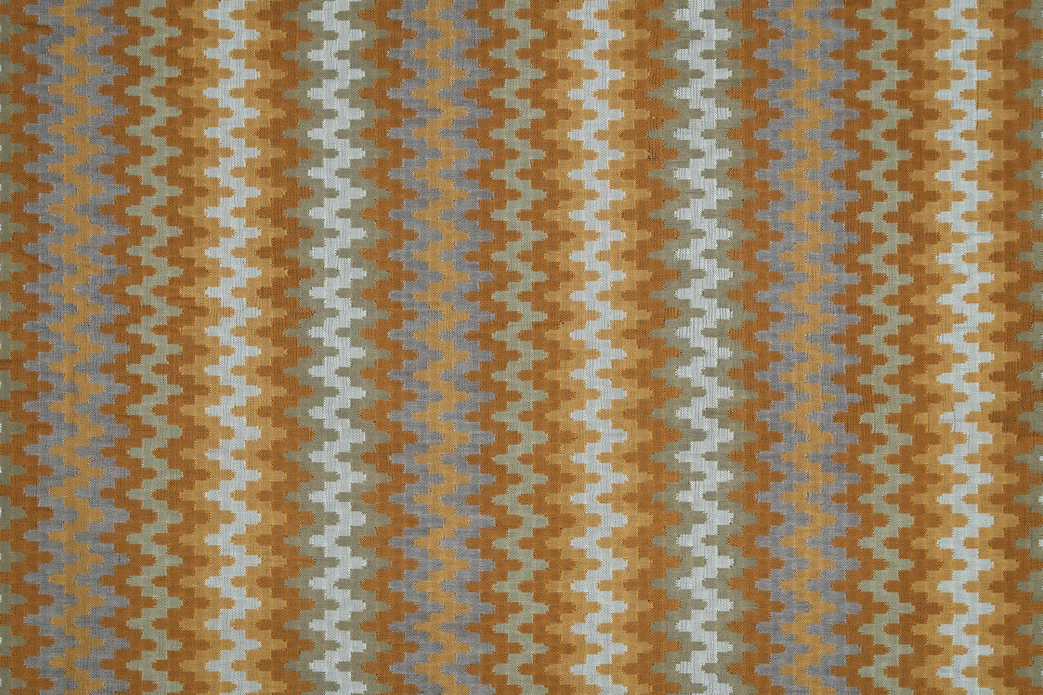 Handwoven silk fabric with zigzag design in brown, gray, and beige colors.