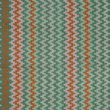 Handwoven silk fabric with zigzag design in green, orange, and beige.