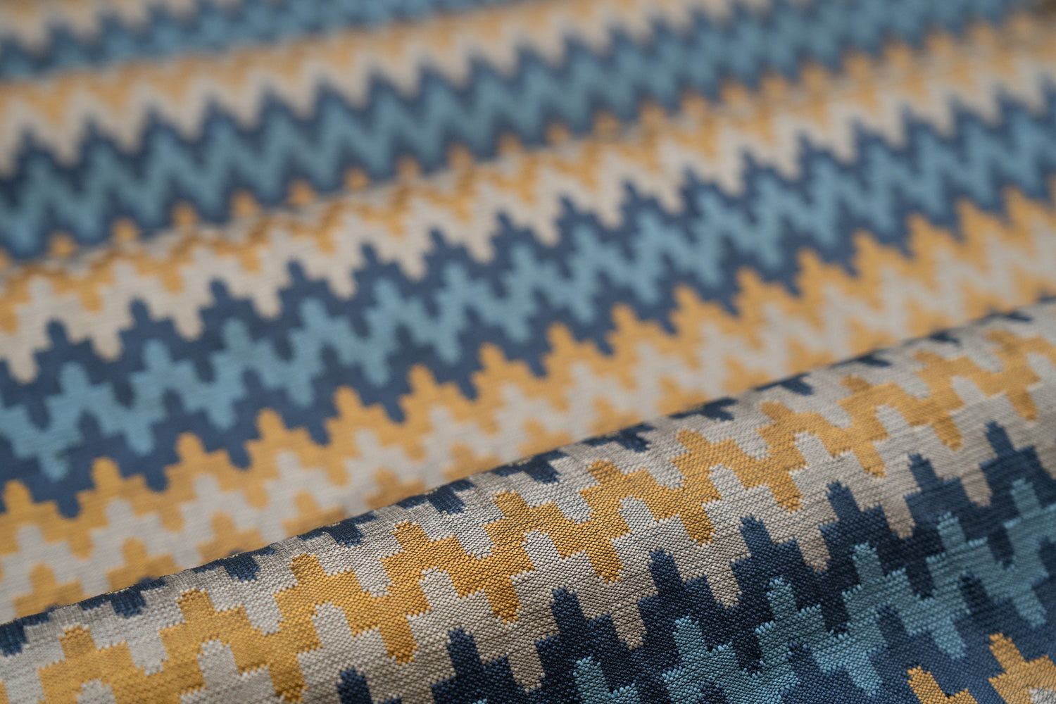 Close-up of fabric with blue and yellow zigzag pattern