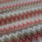 Close-up of fabric with a red and beige geometric pattern
