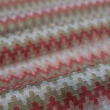 Close-up of fabric with a red and beige geometric pattern