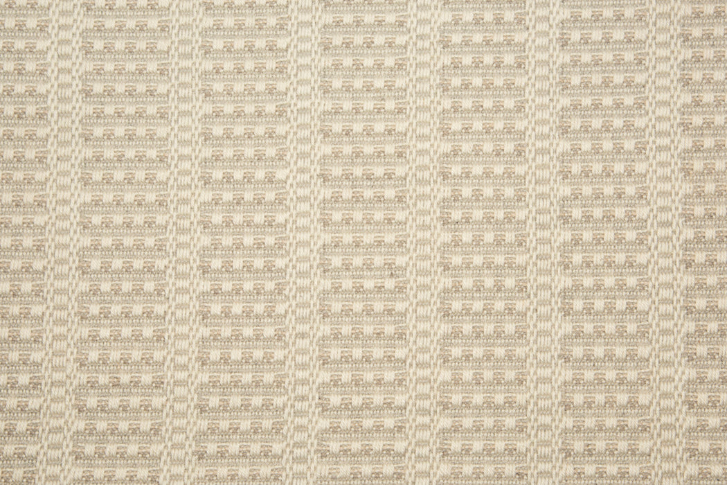 Broadloom carpet with textured stripe design in cream with oatmeal accents. 