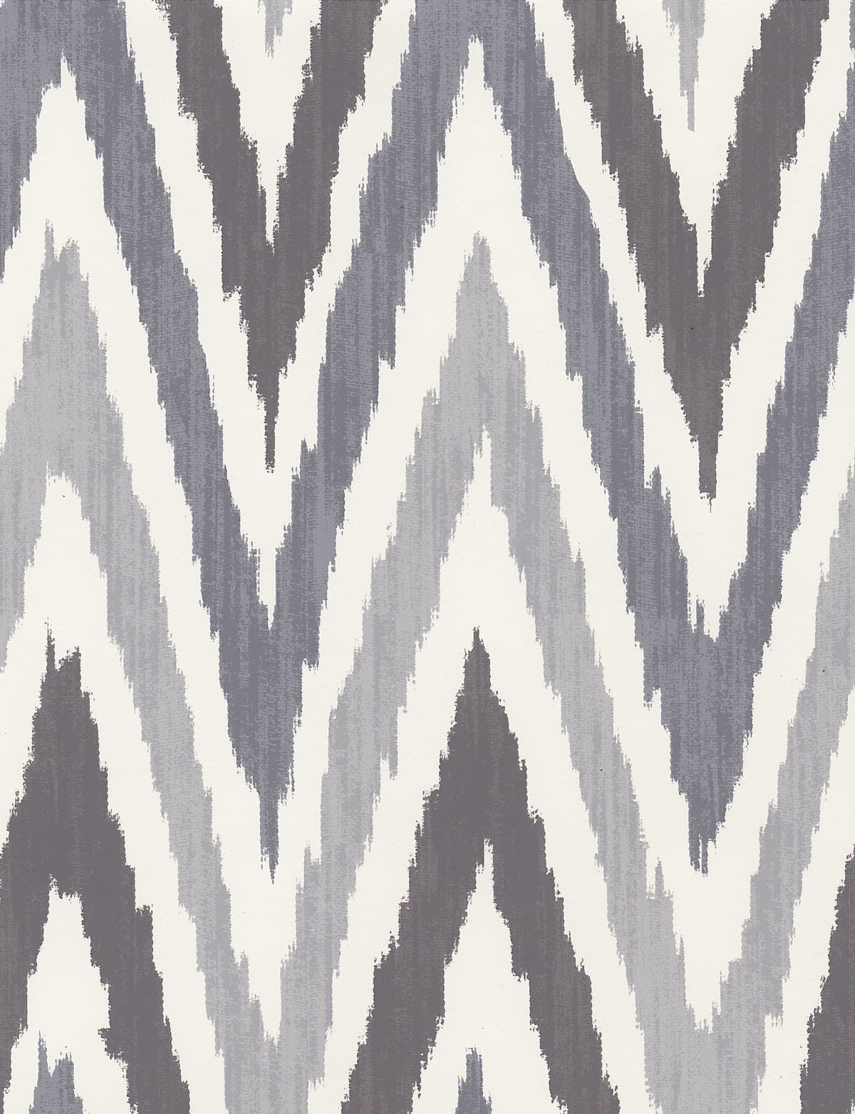 Detail of wallpaper in a geometric ikat print in shades of gray on a white field.