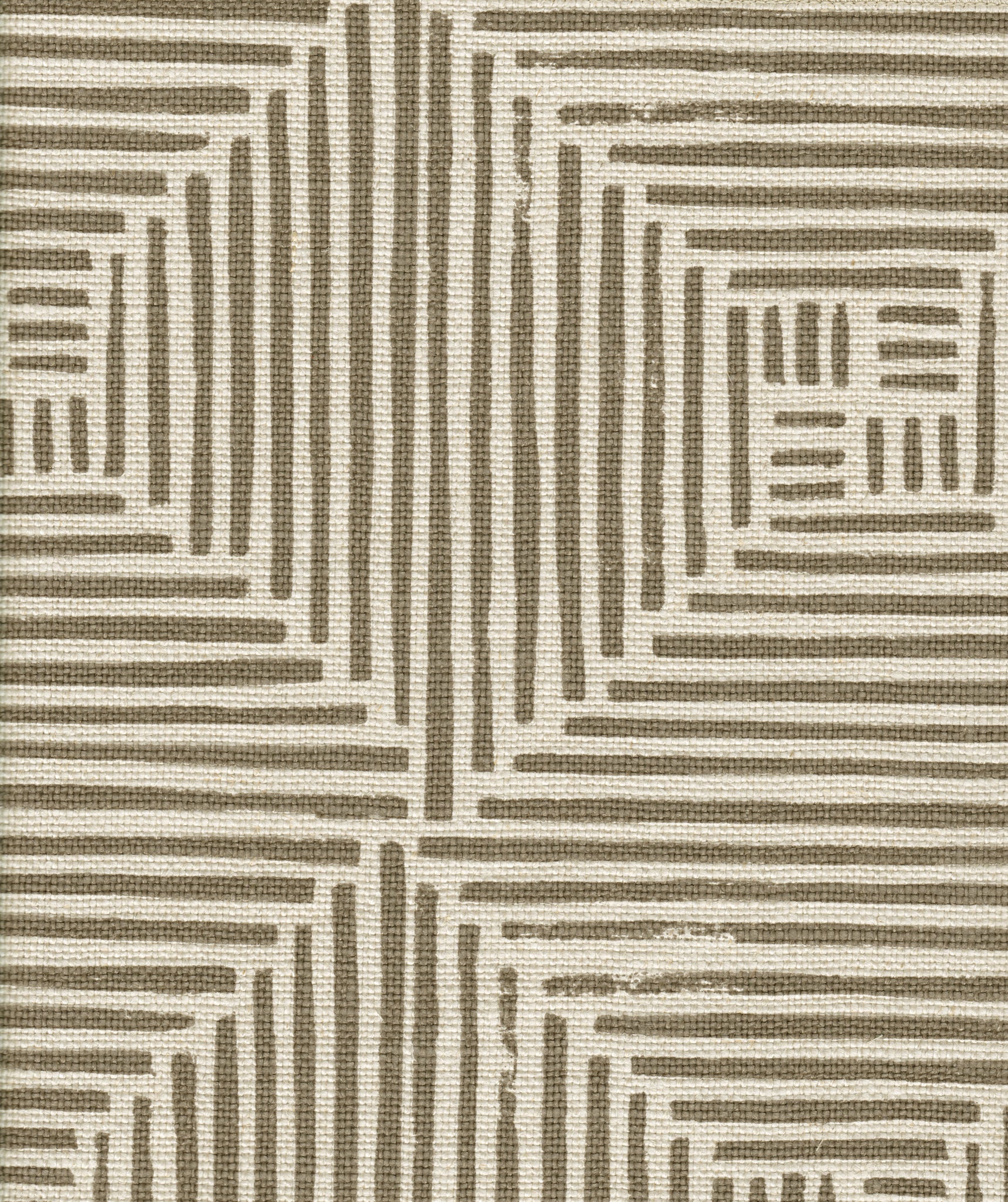 Detail of fabric in a dashed grid print in brown on a cream field.