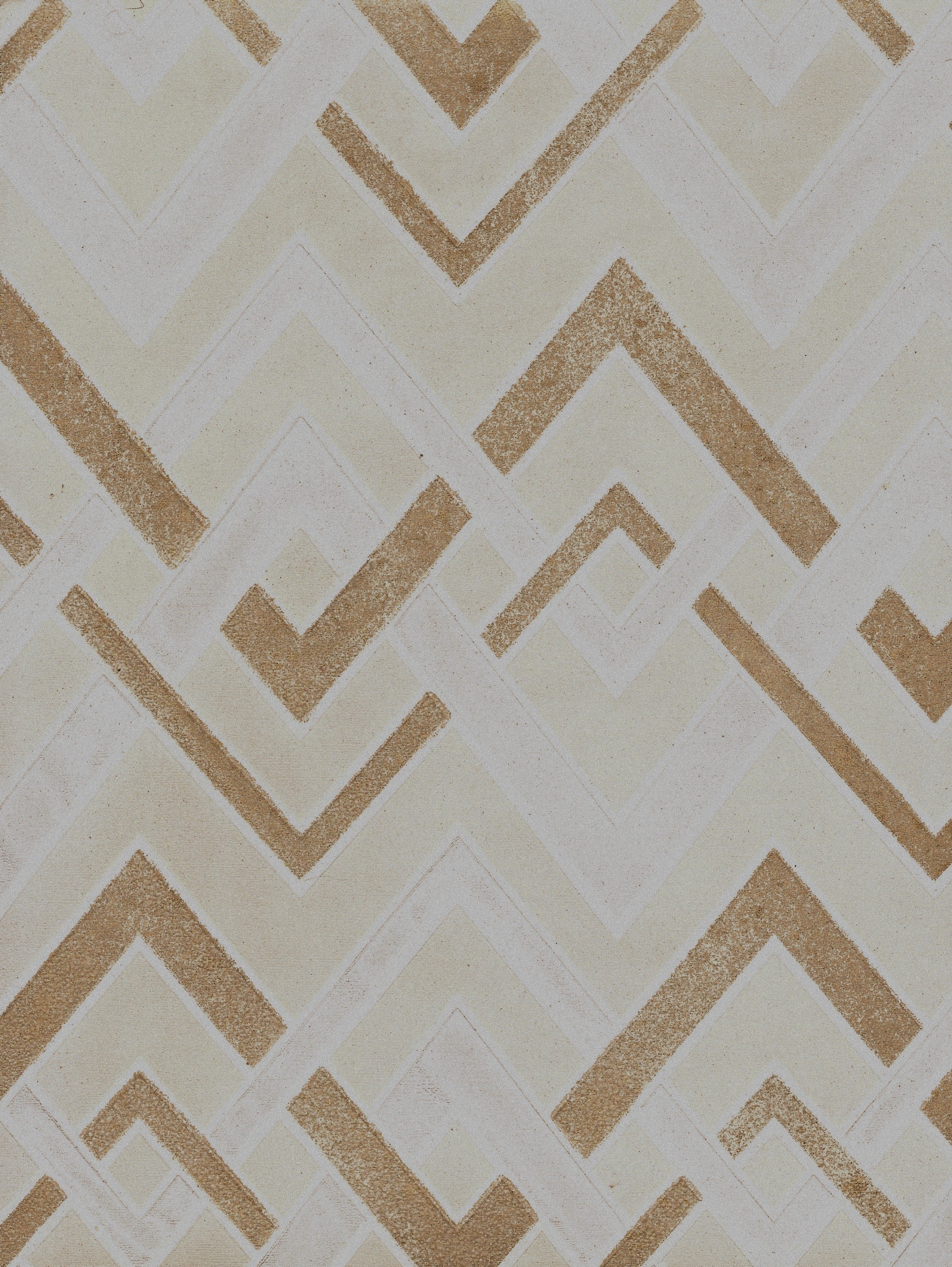Detail of wallpaper in an interlocking zig zag print in shades of white, gold and cream.