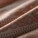 Close-up of textured brown fabric with geometric pattern