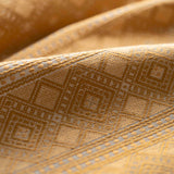 Close-up of textured fabric with geometric pattern in yellow