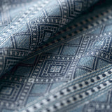 Close-up of textured fabric with geometric pattern in blue