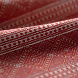 Close-up of patterned red abric with geometric design
