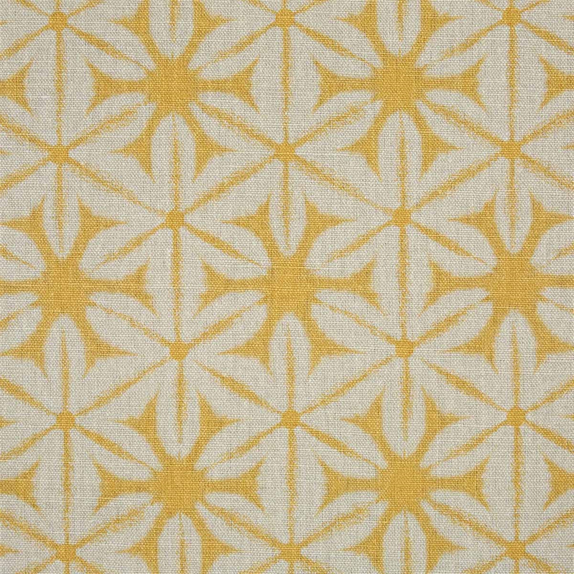 Printed linen in a shibori tie-dye pattern in yellow. 