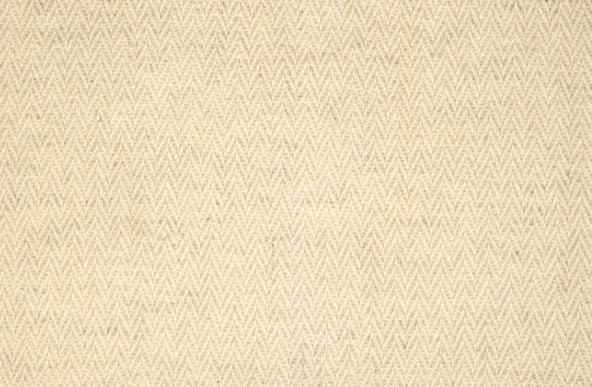 Broadloom carpet with a subtle herringbone pattern in ivory