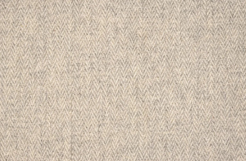 Broadloom carpet with a subtle herringbone pattern in grey and ivory