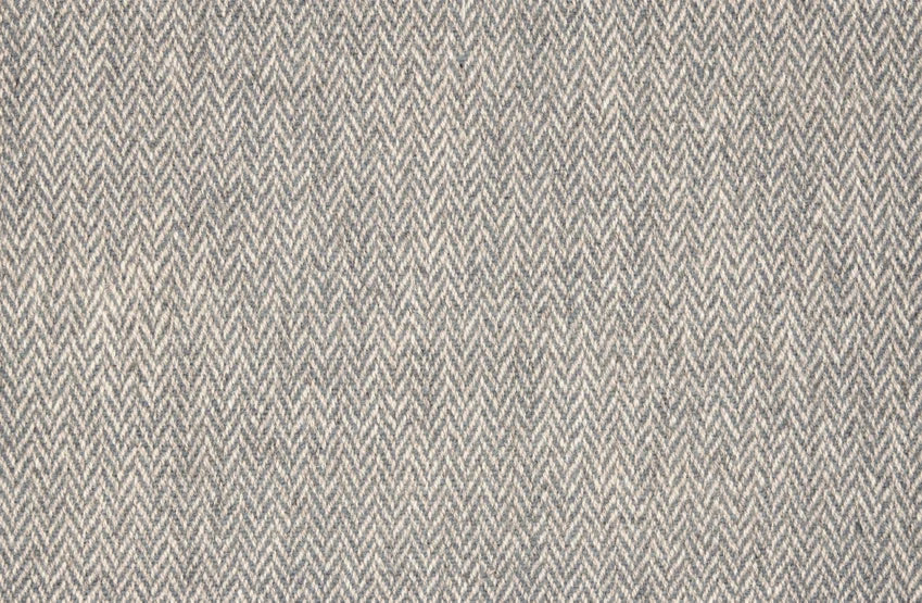 Broadloom carpet with a subtle herringbone pattern in slate blue