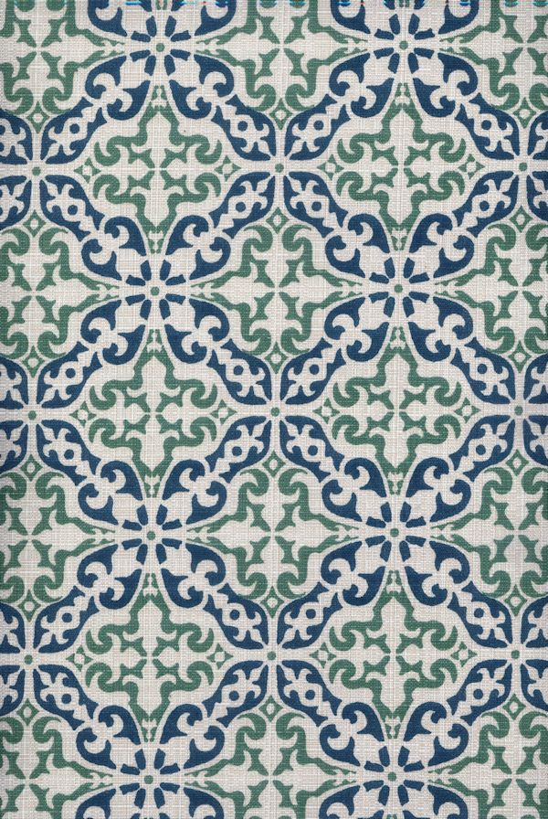 Detail of fabric in a damask print in green and navy on a cream field.