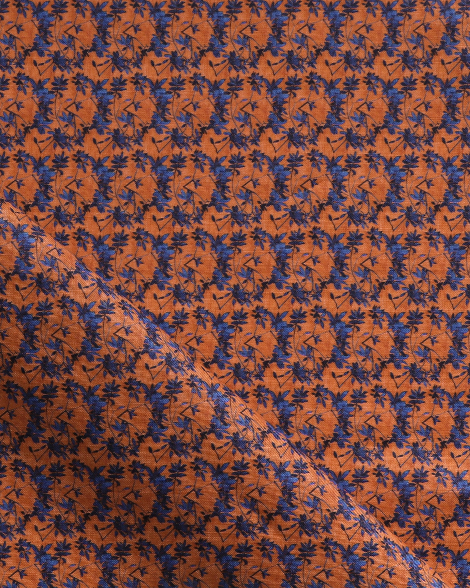 Fabric with small scale watercolor floral in blue and orange.