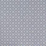 Broadloom carpet with dotted lattice in cream on a sky blue field. 