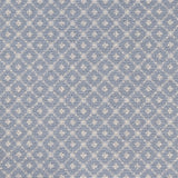 Broadloom carpet with dotted lattice in cream on a sky blue field. 