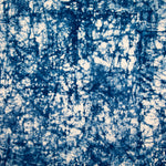 Detail of velvet fabric in an organic crumpled texture in navy on a cream field.