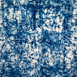 Detail of velvet fabric in an organic crumpled texture in navy on a cream field.