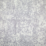 Detail of velvet fabric in an organic crumpled texture in light gray on a cream field.