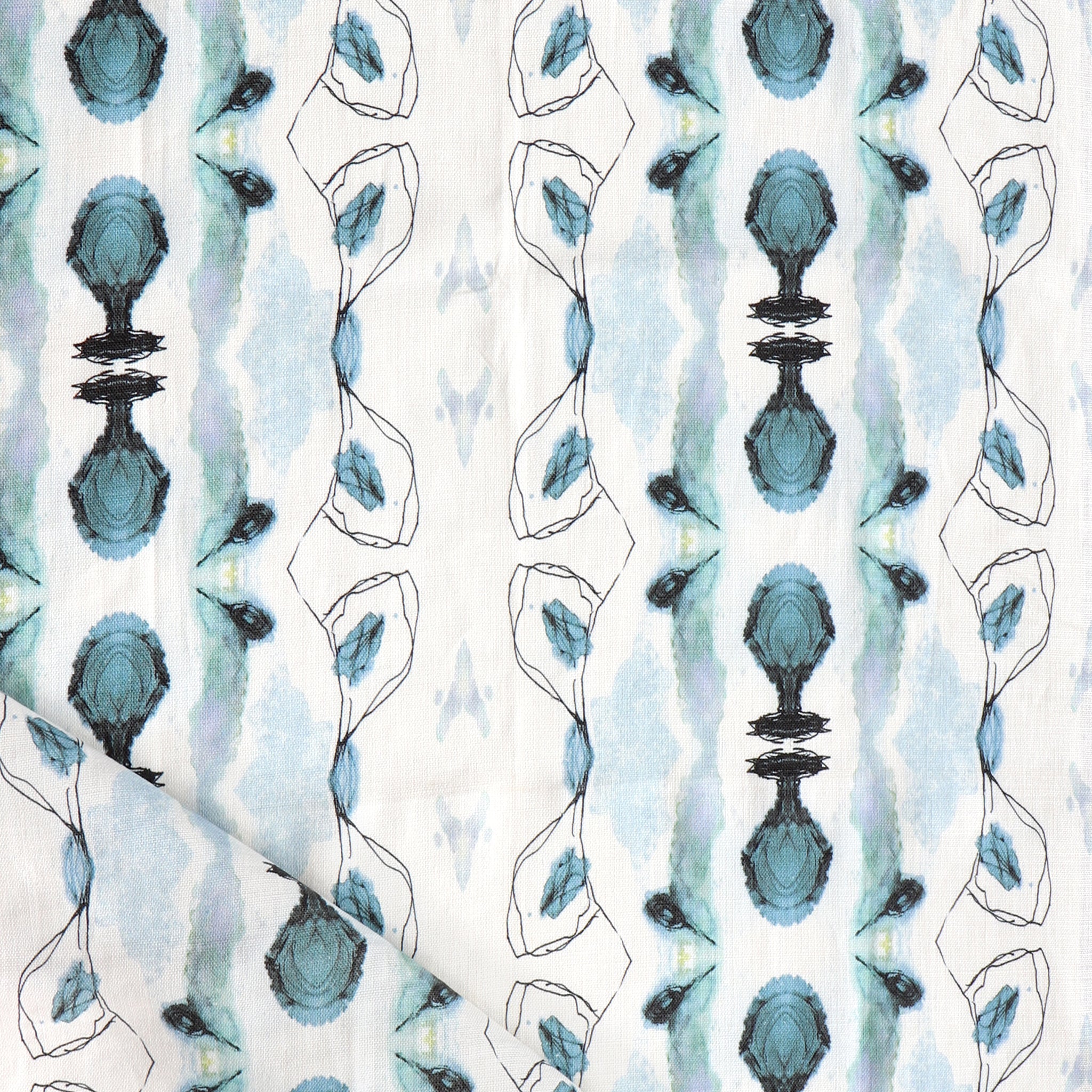 Detail of draped fabric yardage in a watercolor ikat stripe print in shades of blue and gray on a white field.
