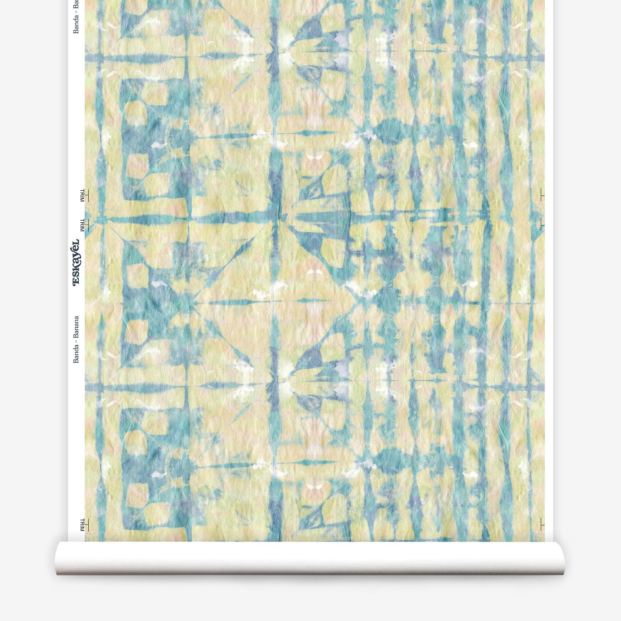 Partially unrolled wallpaper yardage in a watercolor dyed grid print in mottled yellow, blue and white.