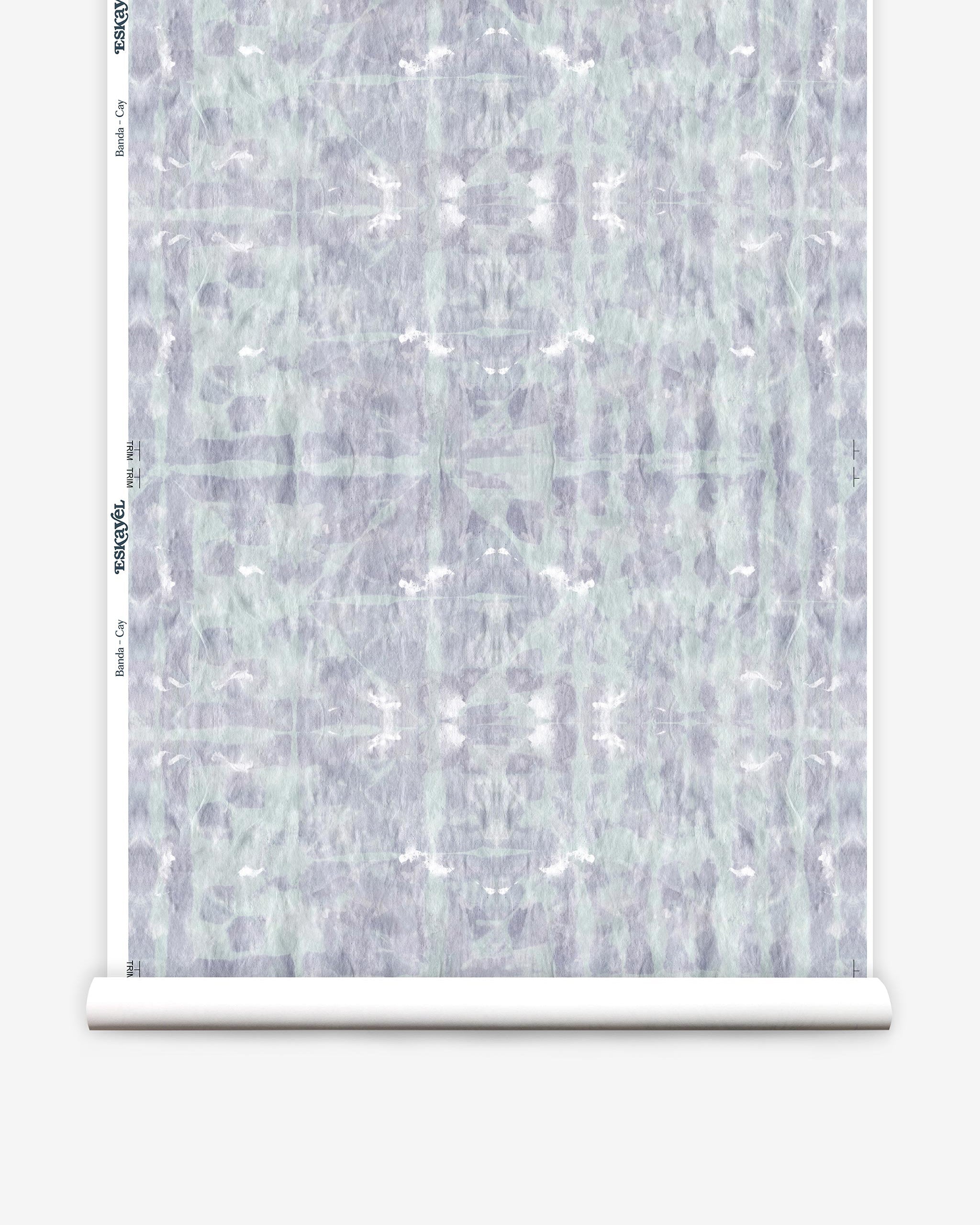 Partially unrolled wallpaper yardage in a watercolor dyed grid print in mottled purple and turquoise.