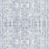 Detail of wallpaper in a watercolor dyed grid print in mottled purple and turquoise.