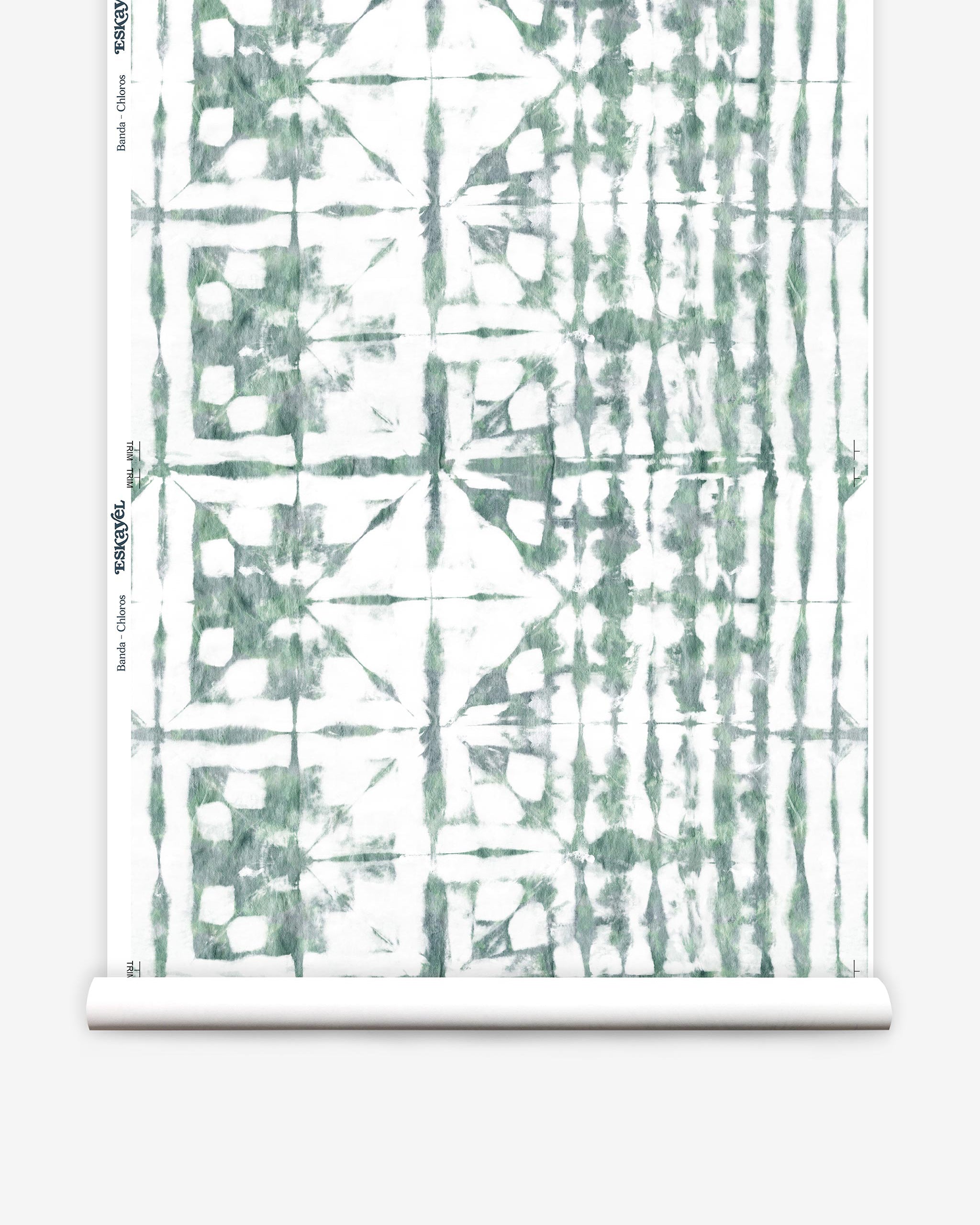Partially unrolled wallpaper yardage in a watercolor dyed grid print in mottled white and green.