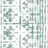 Detail of wallpaper in a watercolor dyed grid print in mottled white and green.