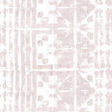 Detail of wallpaper in a watercolor dyed grid print in mottled white and pink.