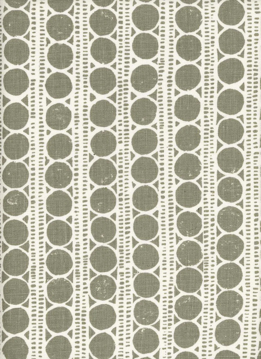 Patterned fabric with grey circles on a white background