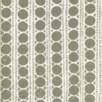 Patterned fabric with grey circles on a white background