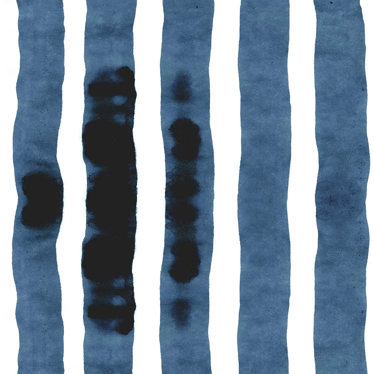 Wallpaper close up with bold watercolor stripes in inky blue and white. 