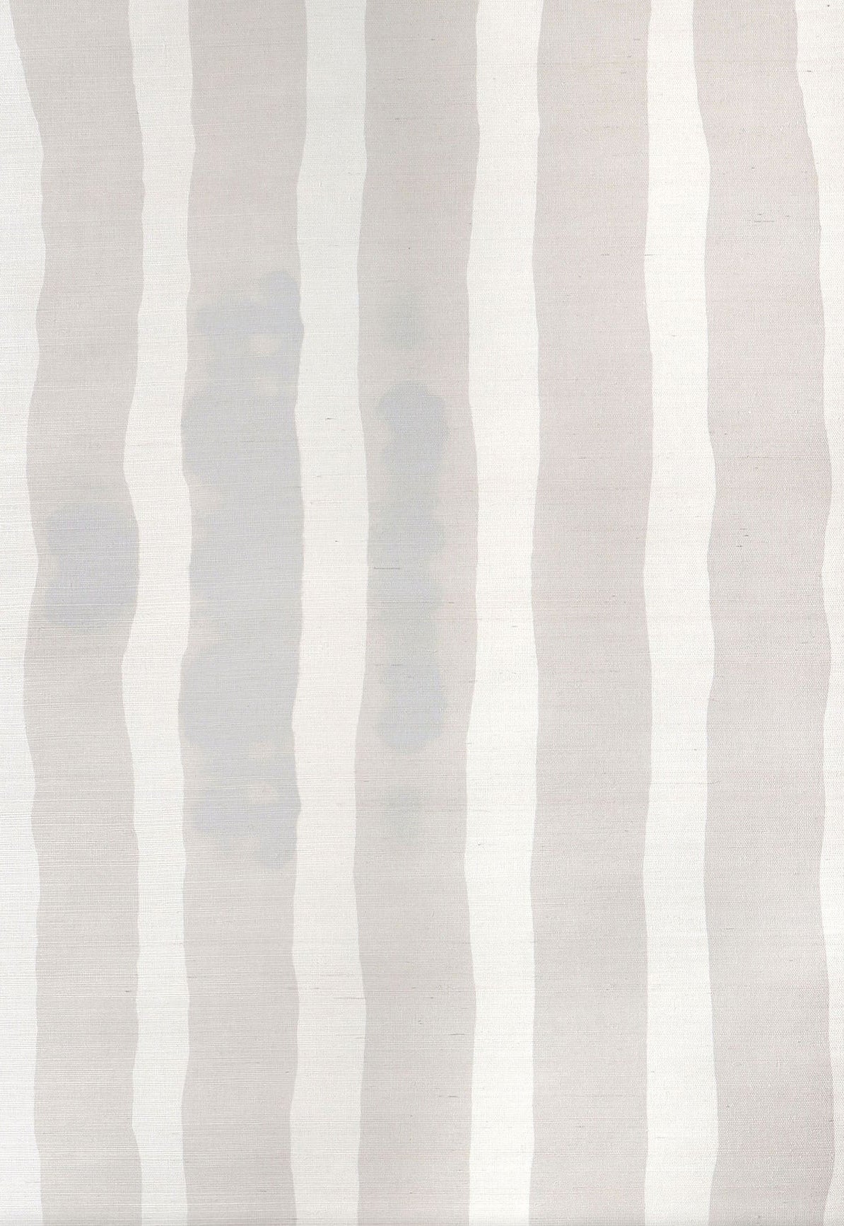 Grasscloth Wallpaper close up with bold watercolor stripes in greige and white. 